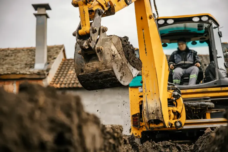 worker-backhoe-is-digging-pit-reconstruction-area