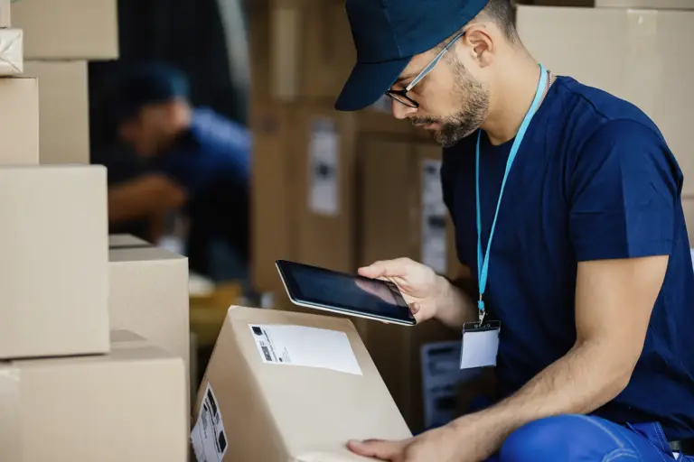 young-delivery-man-using-touchpad-scanning-bar-code-label-cardboard-box-van